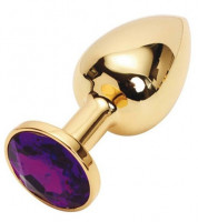 Интимные украшения - Золотистая металлическая анальная пробка с фиолетовым стразом - 7,6 см.